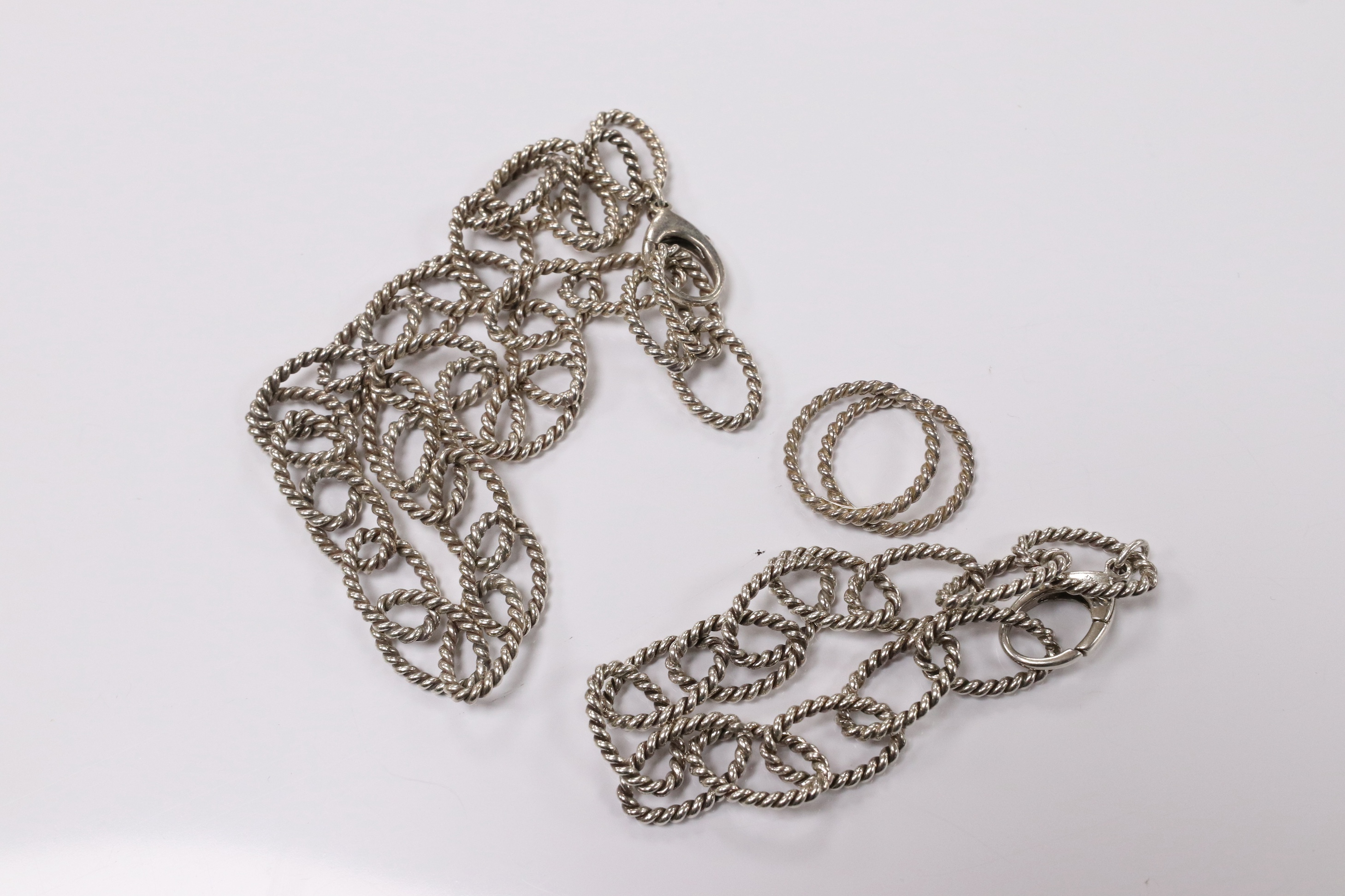 A modern Italian Tiffany & Co 925 suite of jewellery, of rope twist design, comprising a necklace, 42cm, bracelet, 18cm and two rings, size O/P and O. Condition - fair to good